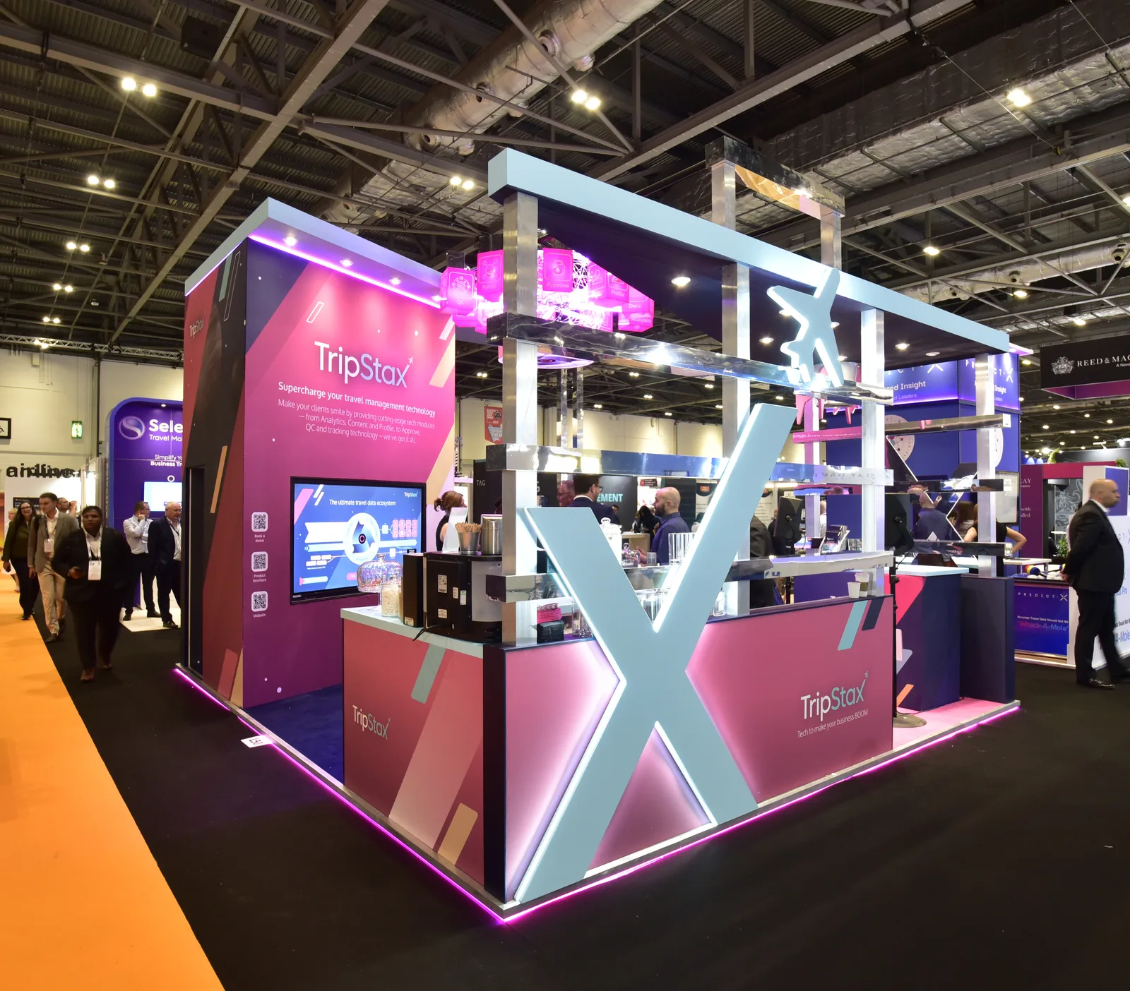 Sustainable exhibition stand design with suspended rig above.